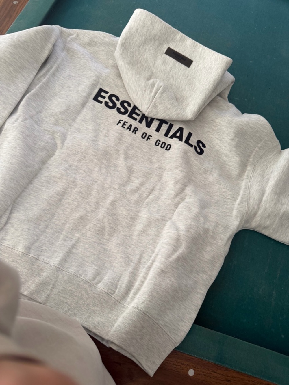 Fear of God ESSENTIALS Light Gray Hoodie with Black Logo